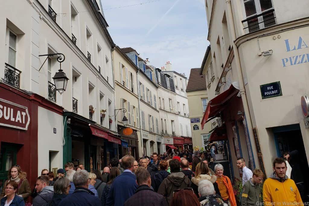 Is Paris overrated and crowded? It can be. Pictured is a crowded street in Montmartre