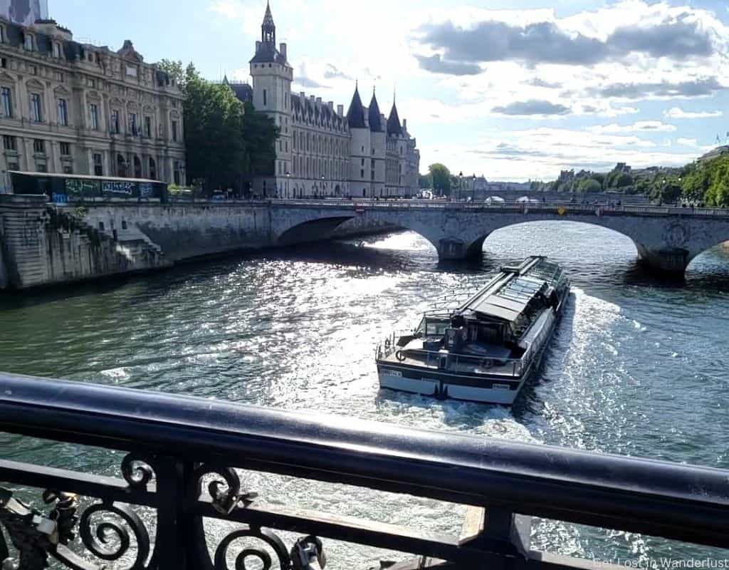 A boat cruising along the Seine River in Paris