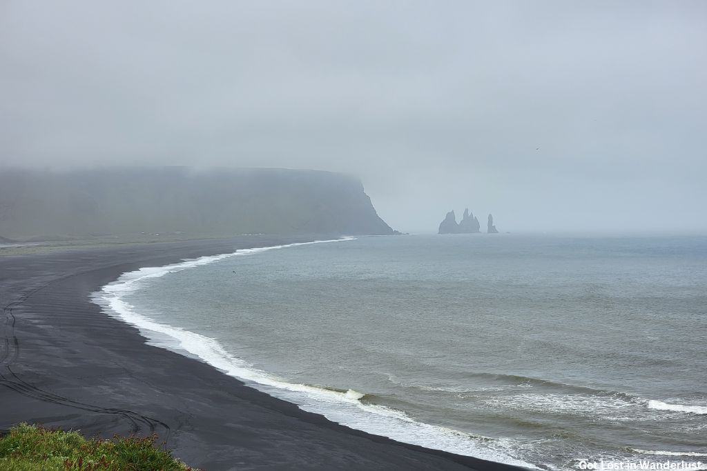Dense fog over the black sand beach in Vik.