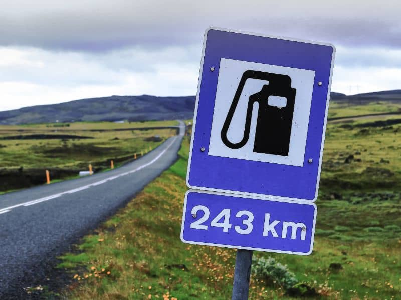Sign showing when the next gas station is