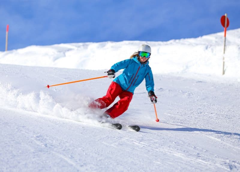 A person skiing down a snowy slope.