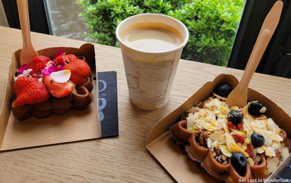 Belgian waffles with fresh fruit on top - a must try food item while taking a day trip from Paris to Bruges
