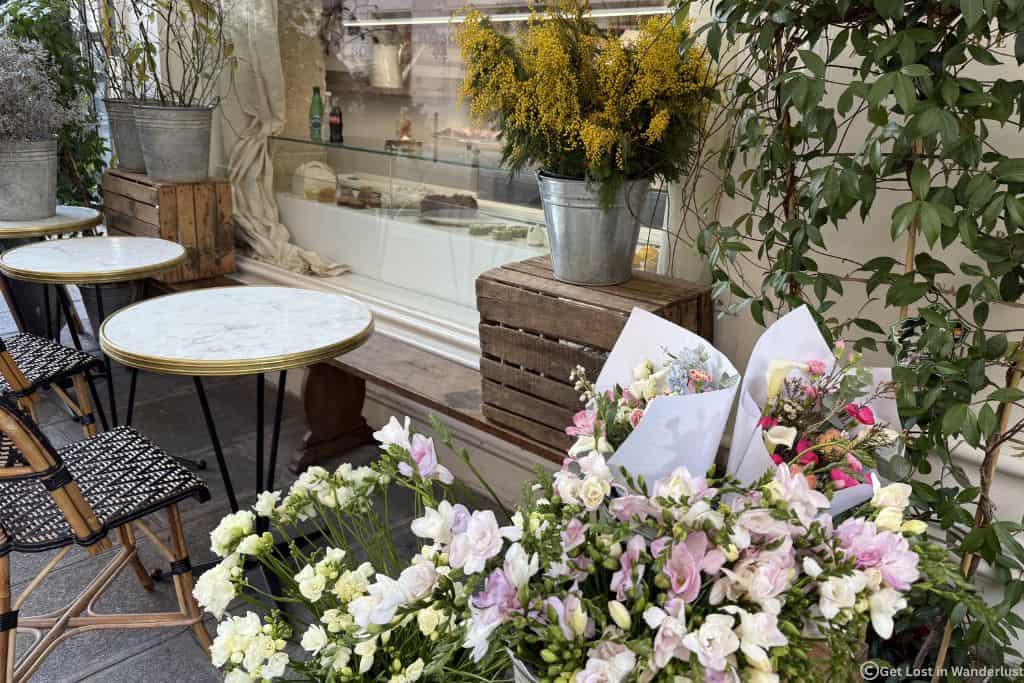 Parisian cafe with fresh flowers in one of the nicest neighborhoods in Paris.