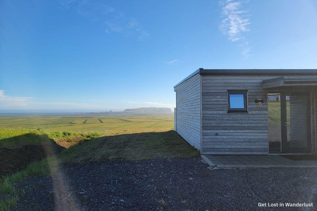 The exterior of Black Beach Suites with the sweeping views in the background.