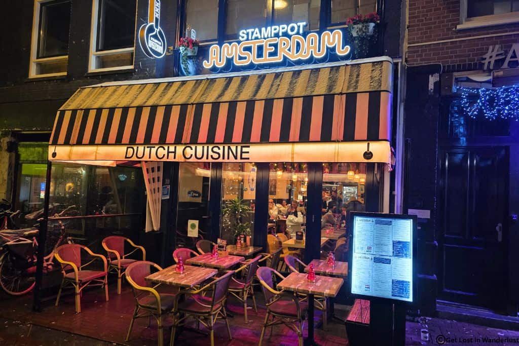 Stamppot Amsterdam restaurant showing outdoor seating and a Dutch cuisine sign. This is a classic Dutch cuisine that is perfect comfort food for a winter night!