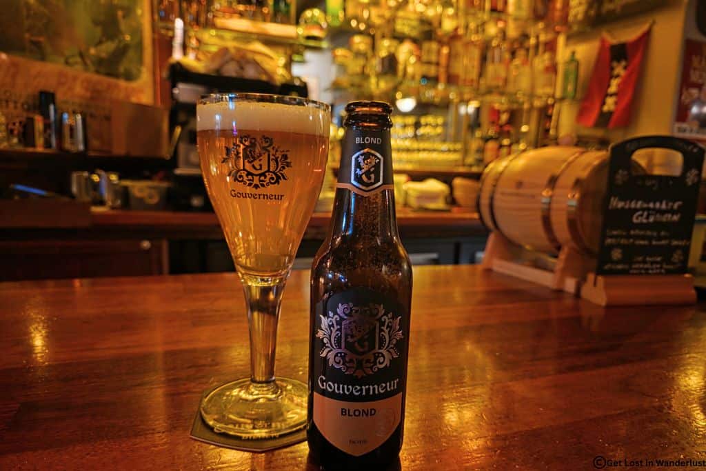 Two local beers on the bar with a cozy traditional pub atmosphere.