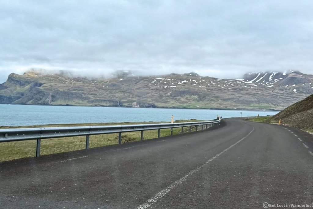 Scenic views from the passenger window while driving in Iceland.