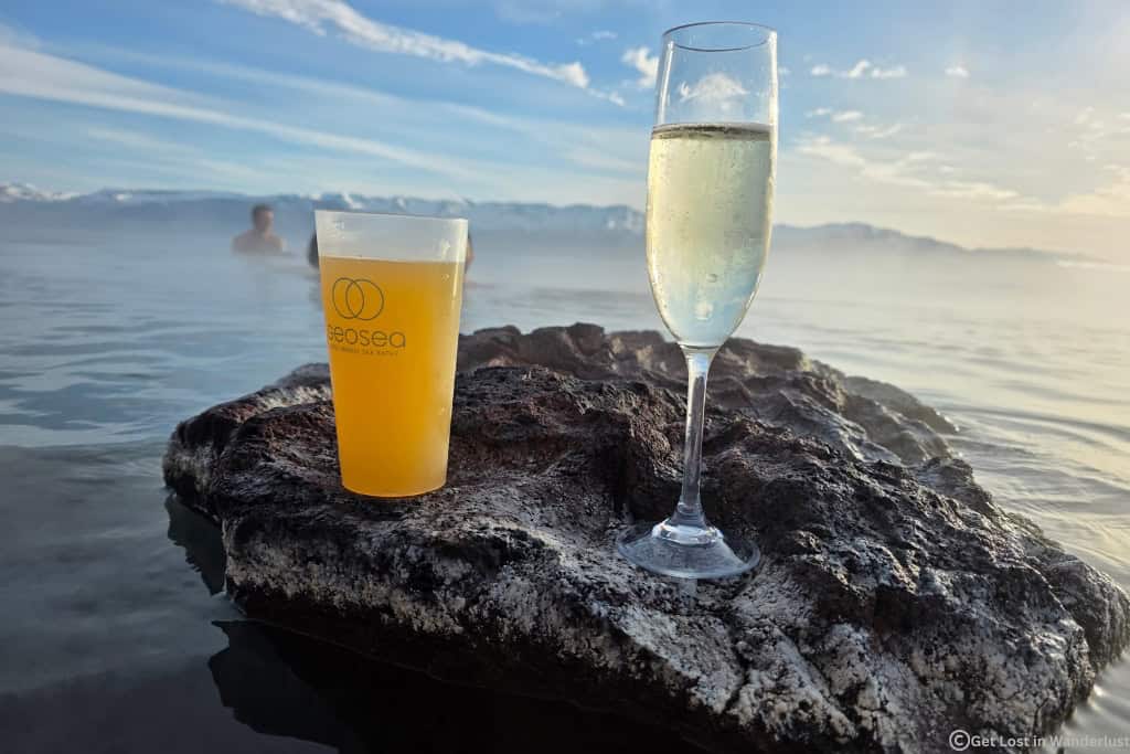 Two drinks on a volcanic rock at the GeoSea lagoon in northern Iceland.