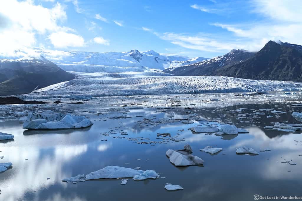Fjallsárlón Glacier Lagoon in Southeast Iceland with floating icebergs and views of the Fjallsjökull glacier.