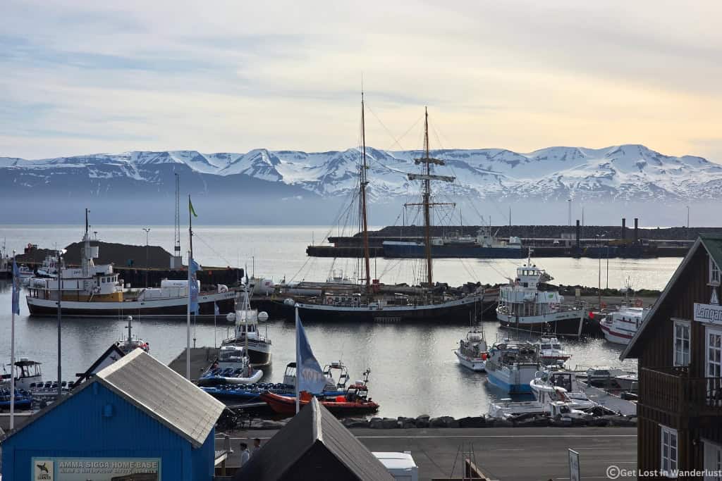 Húsavík Harbor overlooking Skjálfandi Bay, Iceland's whale watching capital in North Iceland. This is a must-add stop if you are driving the Ring Road in Iceland.