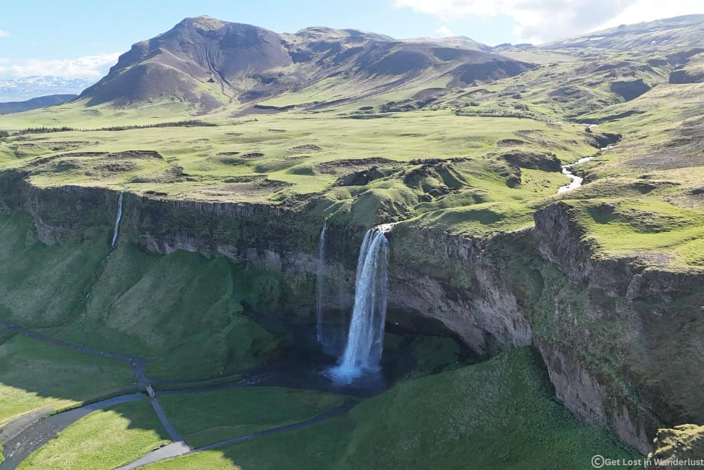 Unique aerial view of Seljalandsfoss Waterfall near Route 1 in South Iceland, one of the most popular stops on the Ring Road.