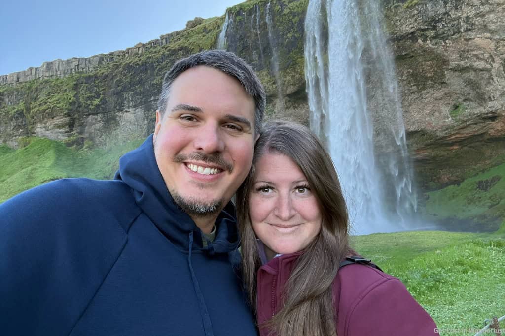 Us in front of Seljalandsfoss, one of the best stops in the south coast while driving the Ring Road in Iceland.