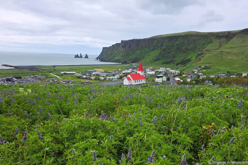 The town of Vik, featuring the Vík í Mýrdal Church. Vik is the best place to stay when visiting South Iceland.