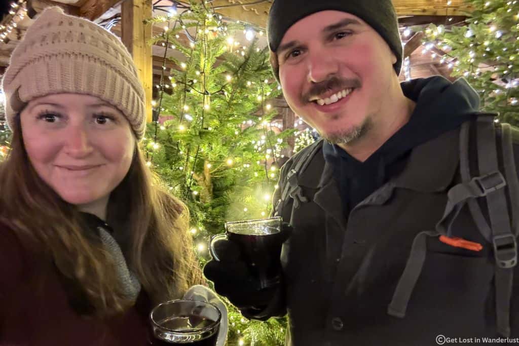 Us enjoying mulled wine on a Christmas market day trip from Paris.