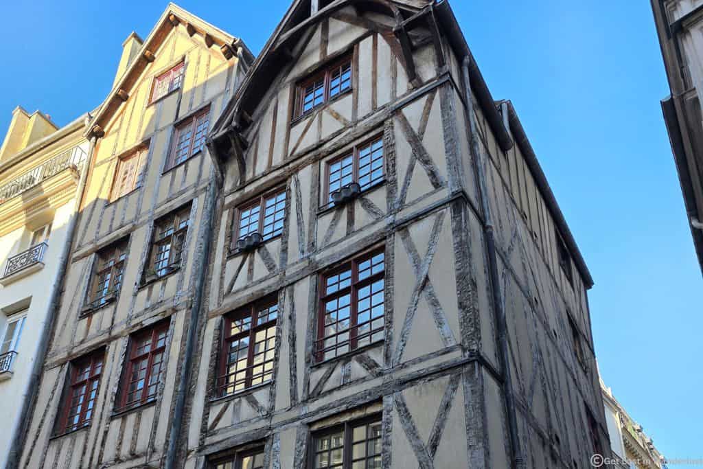 Historic half-timbered building on a quiet street in Paris