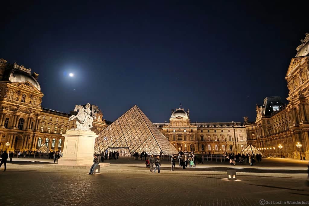 The Louvre at night, worth visiting.