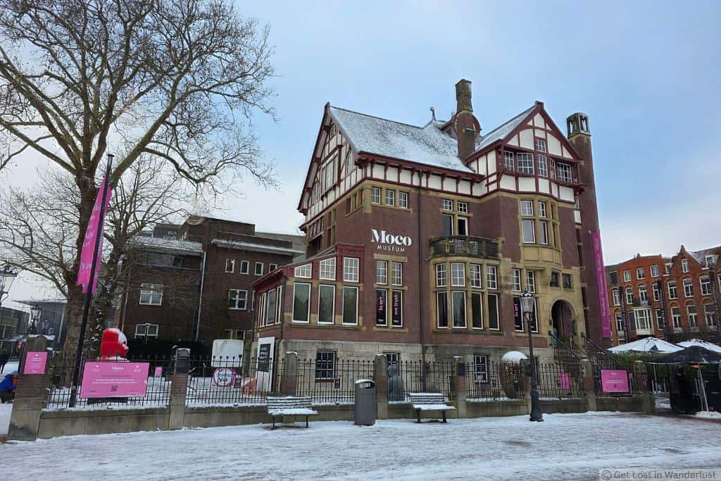 Moco Museum in Amsterdam’s Museum Quarter on a snowy winter day, showing the historic Villa Alsberg building.
