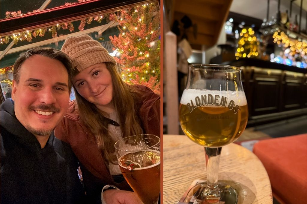 Us enjoying Belgian beer in Bruges during Christmas, with festive lights and holiday decorations in the background.